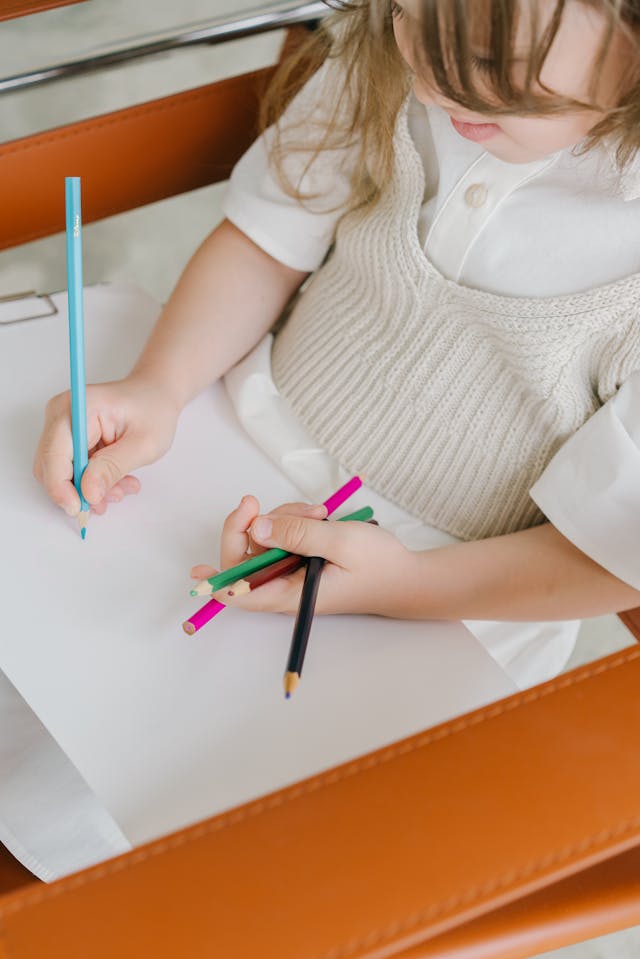 A Young Girl drawing on the Paper